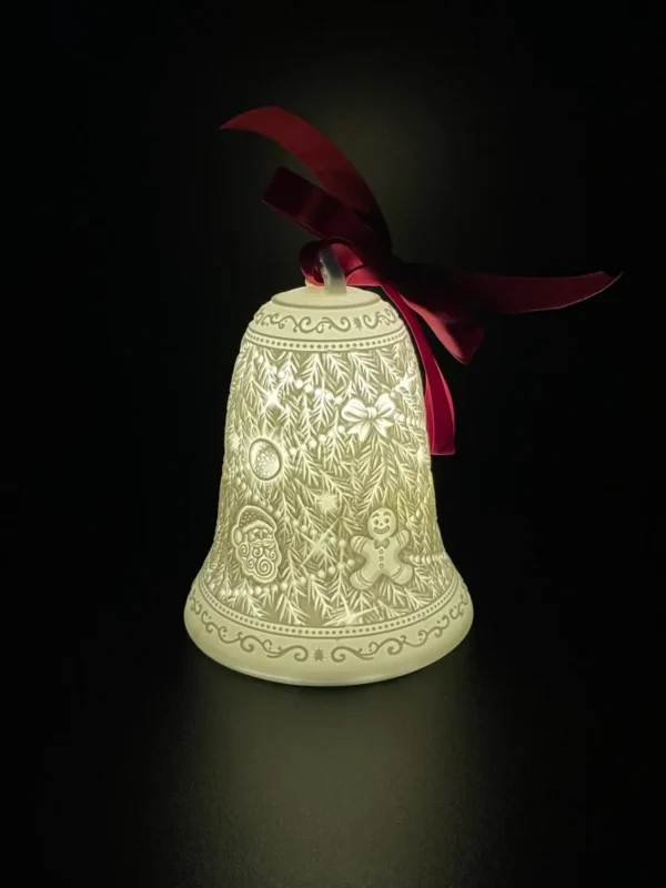 A bell with a red bow on it