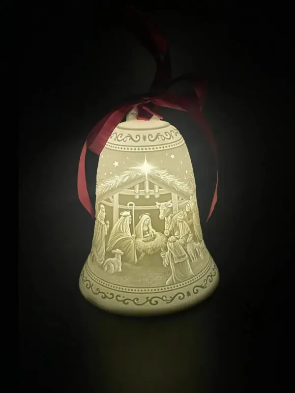 A bell with a picture of jesus in it