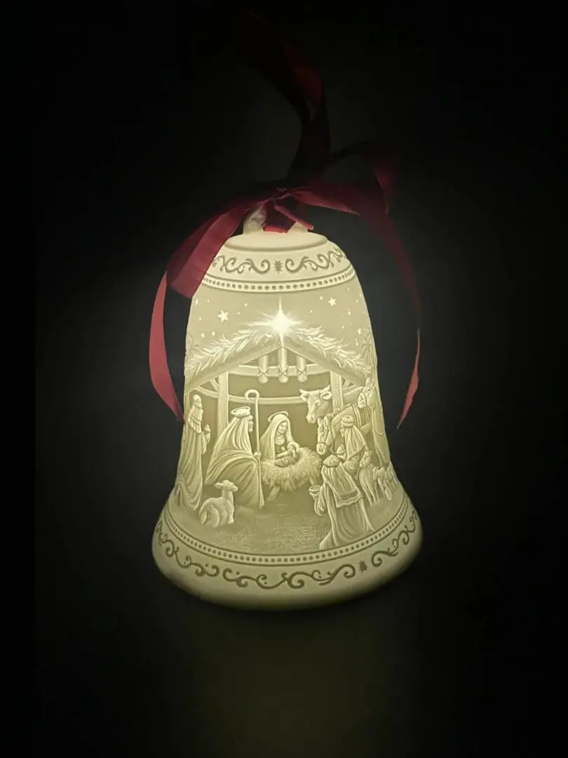 A bell with a picture of jesus in it