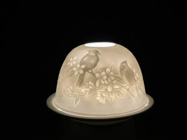 A white bowl with two birds on it