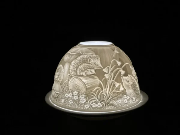 A close up of a candle holder with an animal design